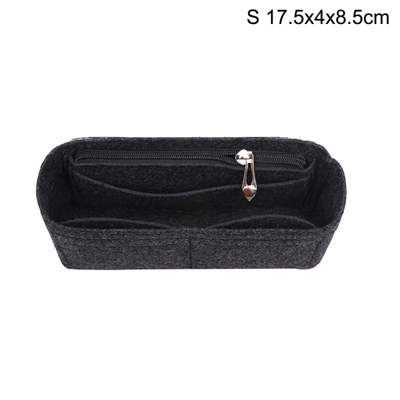 Black felt bag insert organizer with a zipper and a decorative charm