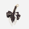 Black and white patterned adjustable bag strap with gold hardware