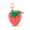 A keychain featuring a strawberry-shaped coin purse with pink and green colors.