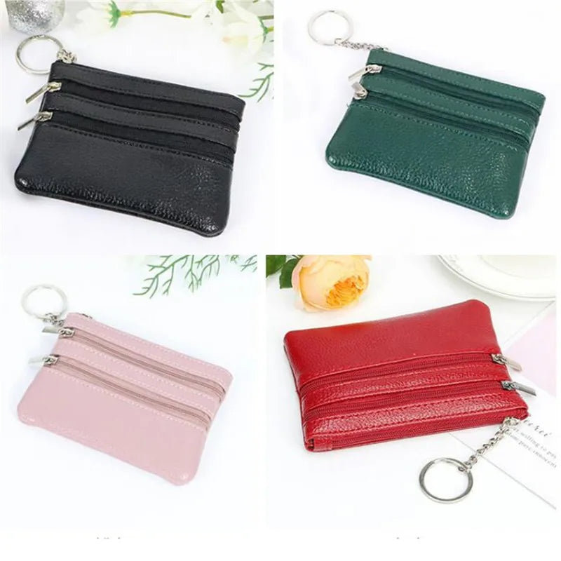 Three stacked PU leather clutch wallets in black, green, and pink with silver chain clasps.