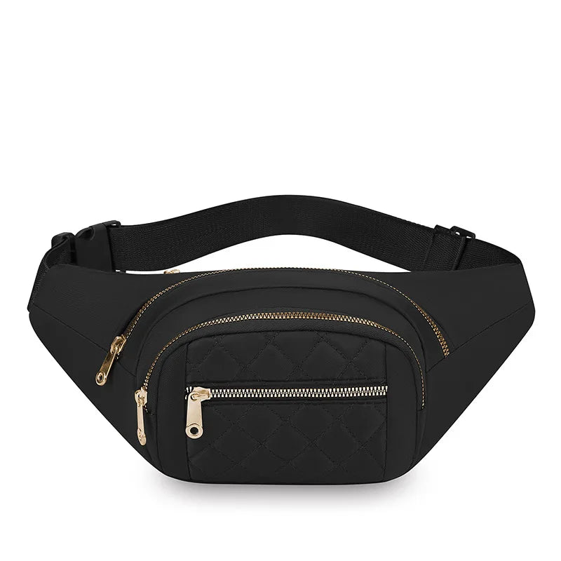 A black quilted nylon crossbody belt bag with a gold zipper is shown from above.