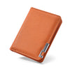 A slim vertical men's card wallet in a burnt orange leather-like material with a silver metal closure.