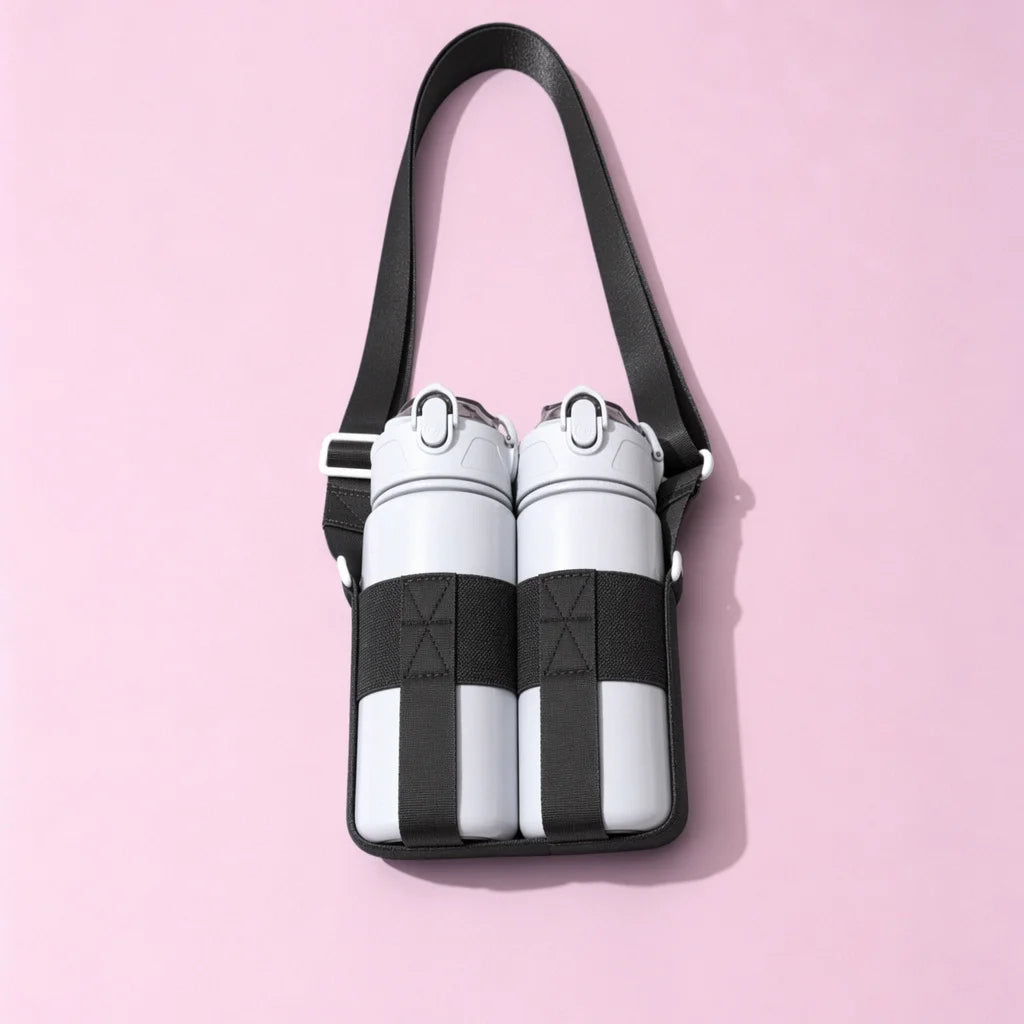 A black crossbody sling water bottle bag with white and black striped bottles.