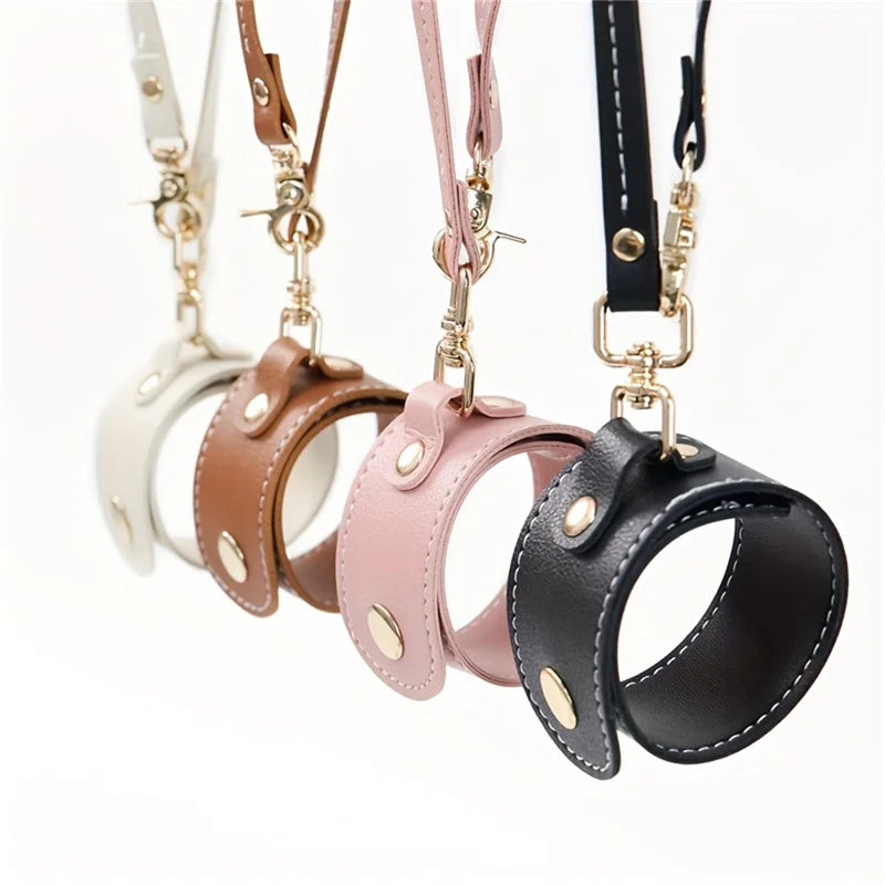 A collection of vintage leather glove holder straps in various colors including white, brown, and pink.