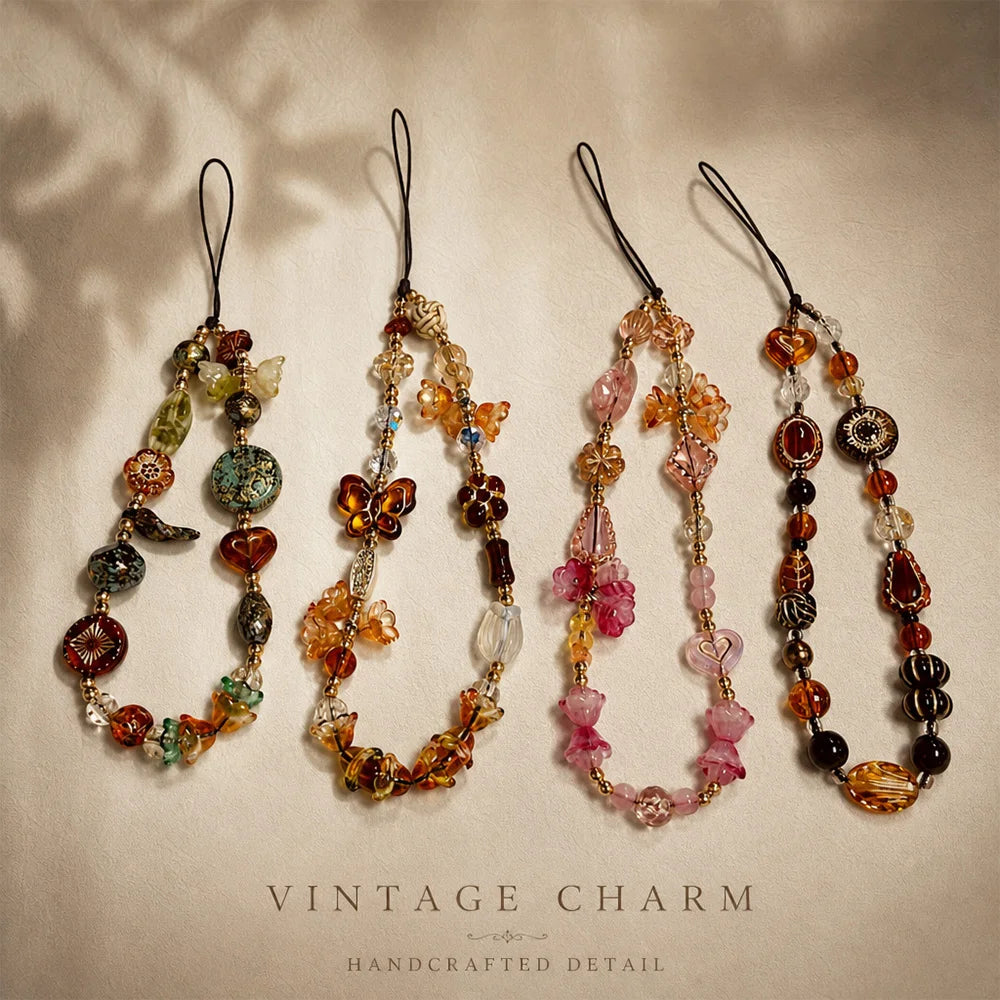 Four vintage beaded charm necklaces displayed on a neutral background with soft shadows.