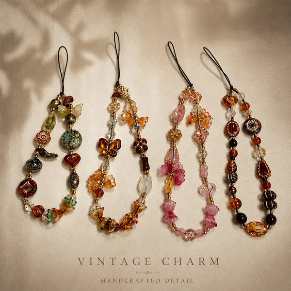 Four vintage beaded charm necklaces displayed on a neutral background with soft shadows.