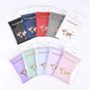 A collection of elegant PU leather passport holder wallets in various colors including blue, red, gray, and pink.