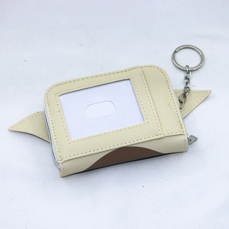 A beige loungefly zipper wallet with a square clear window and a brown patterned flap.
