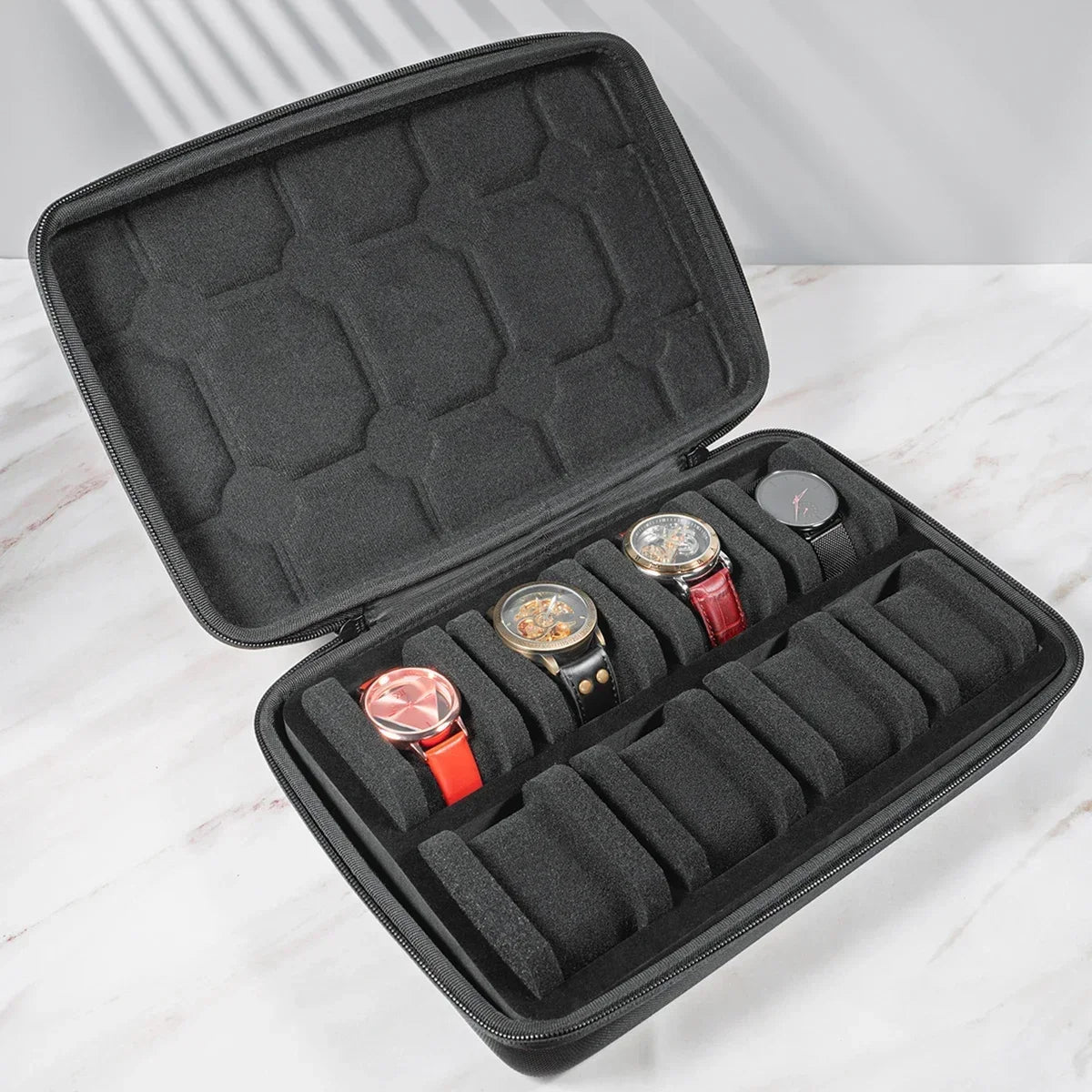 A black premium leather watch organizer travel case with multiple compartments for storing watches.