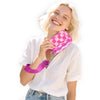 A blonde woman smiling while holding a pink checkered wallet with an ID window.