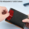 A hand holds a black card wallet with a red reward card inside, demonstrating easy access to frequently used cards.