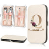 A beige cosmetic case holding a stainless steel nail clipper set and a large cosmetic pouch.