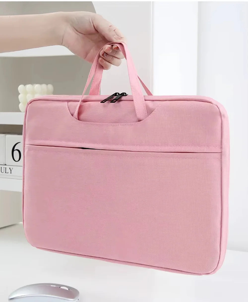 A pink premium laptop sleeve is being held by a hand, showing the padded exterior and zipper detail.
