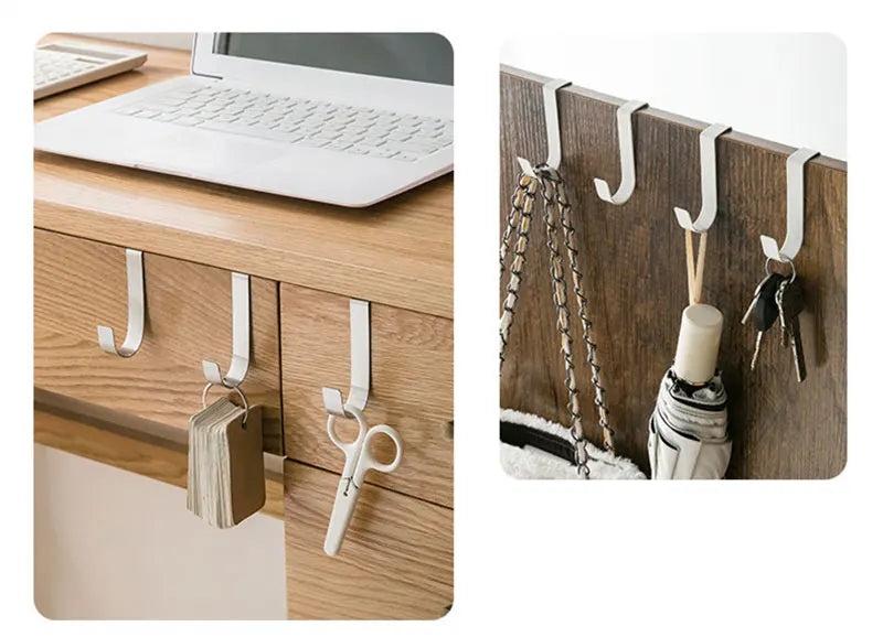 A heavy duty multi-purpose hook rack with hangers is installed on a wooden cabinet door, next to a laptop.