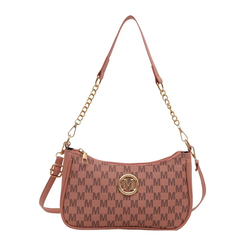 Bolso cruz de cuero dorado vintage en color rosa empolvado.