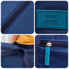 A dark blue foldable travel duffel bag with a teal luggage strap and a tag reading TRAVEL everyday everywhere.