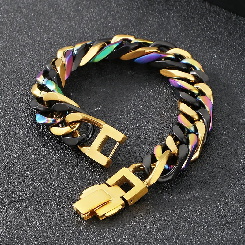 A chunky gold and black Cuban link bracelet with iridescent accents shown on a dark surface.