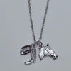 Silver necklace featuring a western cowboy boot and hat horseshoe keychain set