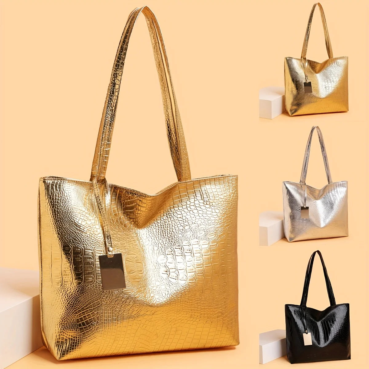 A gold metallic crocodile print zipper tote bag displayed against a beige background.