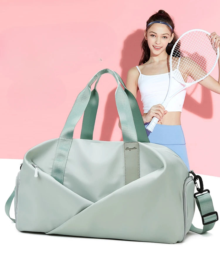 A light green duffel bag with a strap is shown next to a young woman holding a tennis racket.