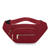 A maroon quilted nylon crossbody belt bag with a gold zipper and black strap.