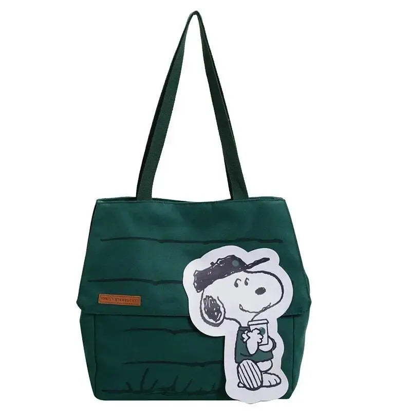 A dark green canvas tote bag featuring a white Snoopy graphic.