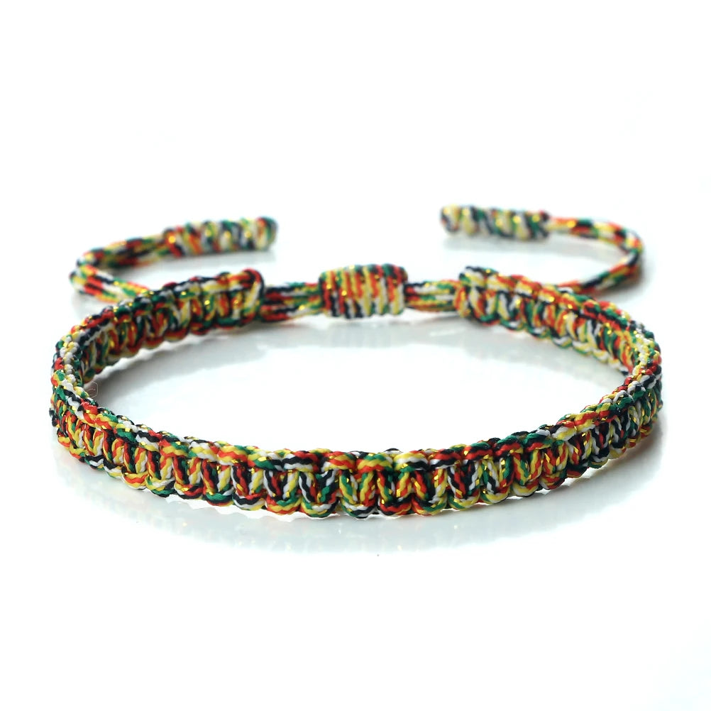 Handmade braided rope bracelet featuring colorful yarn in various shades of green, yellow, and orange.