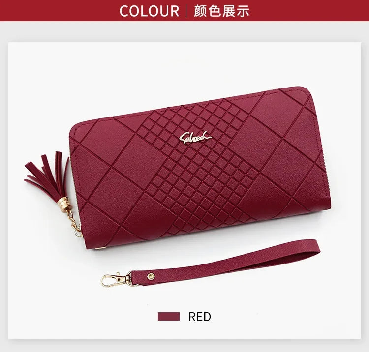 A maroon quilted clutch wallet with a gold chain detail shown against a white background.