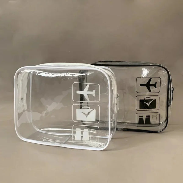 A clear plastic travel toiletry bag with black icons for various toiletries is shown on a neutral background.