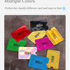 A collection of multiple colored anti-scan card sleeves for RFID protection laid out on a dark surface.