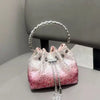 A pink and white crystal-embellished evening clutch with a silver chain and hoop.