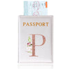 A pink leather passport holder with a gold embossed letter P and an ID card visible above it.
