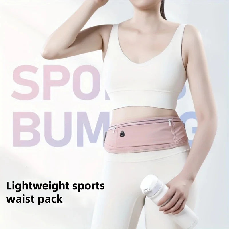 A woman wearing a light pink sports waist pack and white pants, demonstrating the product.