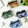 A collection of floral print mini coin purses in various colors and patterns, including orange, green, purple, and blue.