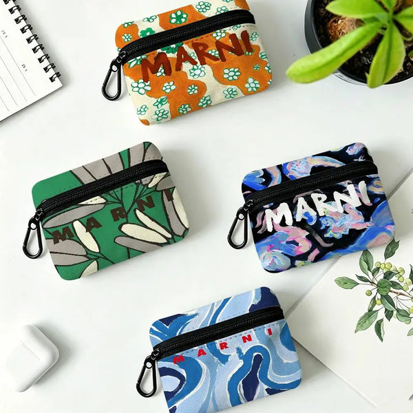 A collection of floral print mini coin purses in various colors and patterns, including orange, green, purple, and blue.