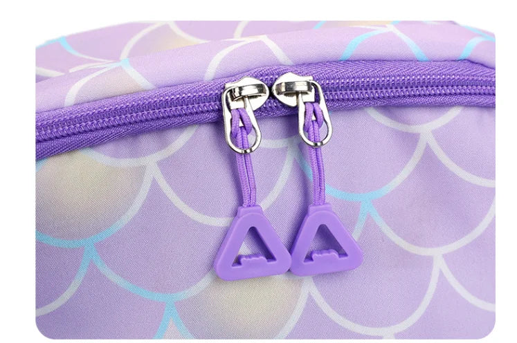 Purple multi-compartment casual backpack with silver zippers and a scale pattern print