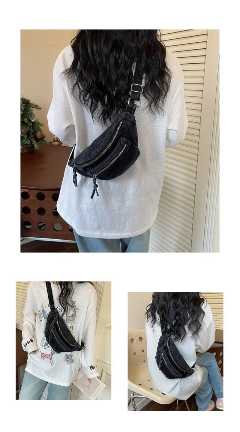 Une personne porte un sac bandoulière en jean vintage délavé noir sur une chemise à manches longues blanche.