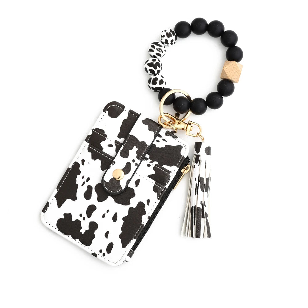 Black and white leopard print leather card holder with a beaded keychain bangle