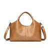 A tan leather women's casual crossbody shoulder bag with a zip closure.