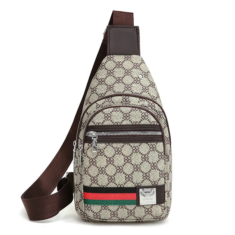 A brown leather crossbody sling bag featuring a beige and brown monogram print and a red, green, and black stripe detail.