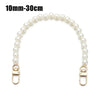A strand of white pearls used as a strap for a handbag or purse.