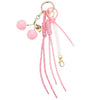 Pink cherry charm bag keychain featuring a gold-colored loop and braided pink rope strands