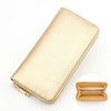 A light beige genuine leather zipper wallet shown in a diagonal angle.