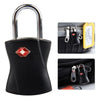 A black keyed luggage lock with a silver shackle and a yellow tag, shown next to a black fabric pouch.