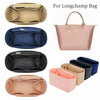 Verschiedene Filz-Organizer und eine rosa Lederhandtasche von Longchamp