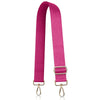 A magenta nylon crossbody bag strap with gold-toned hardware.
