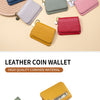 A collection of multiple colored leather coin wallets displayed on a light background.