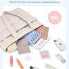 A large beige tote bag is shown with various small cosmetic and personal items placed around it.