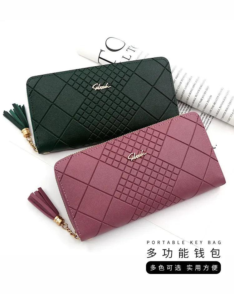 A dark green quilted clutch wallet and a mauve quilted clutch wallet are displayed on a white background.