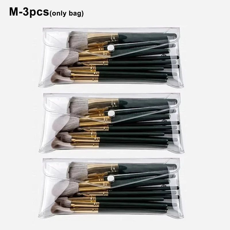 Three sets of black and gold makeup brushes stored in transparent portable organizer pouches